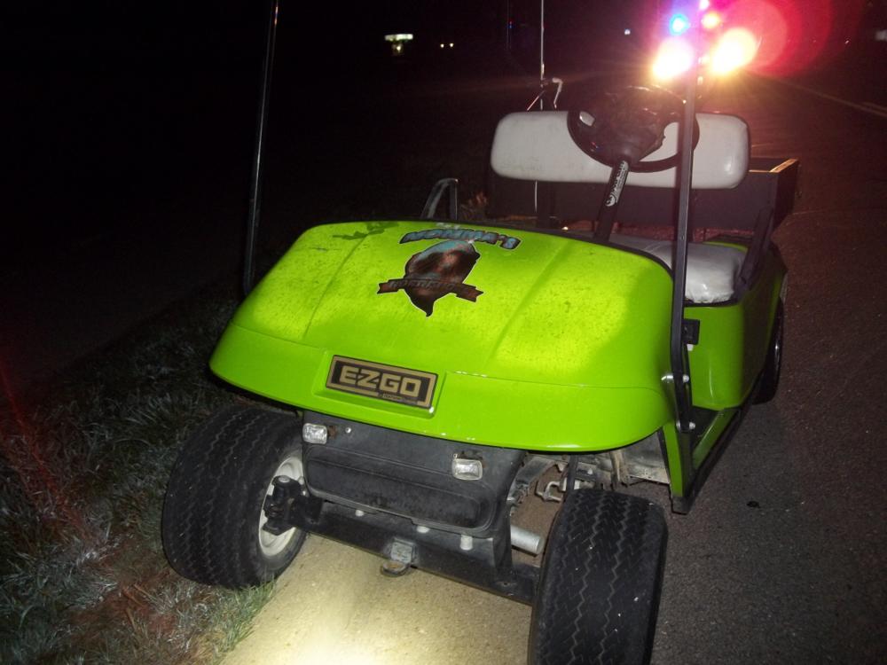 Front of a green gold cart.